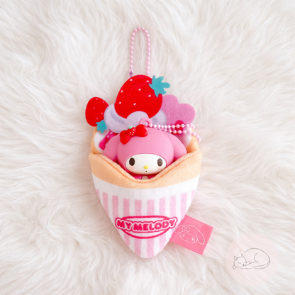 A soft and kawaii plush crepe keychain with cute details and a mini figure inside. Perfect as a bag charm, keychain or small collectible.