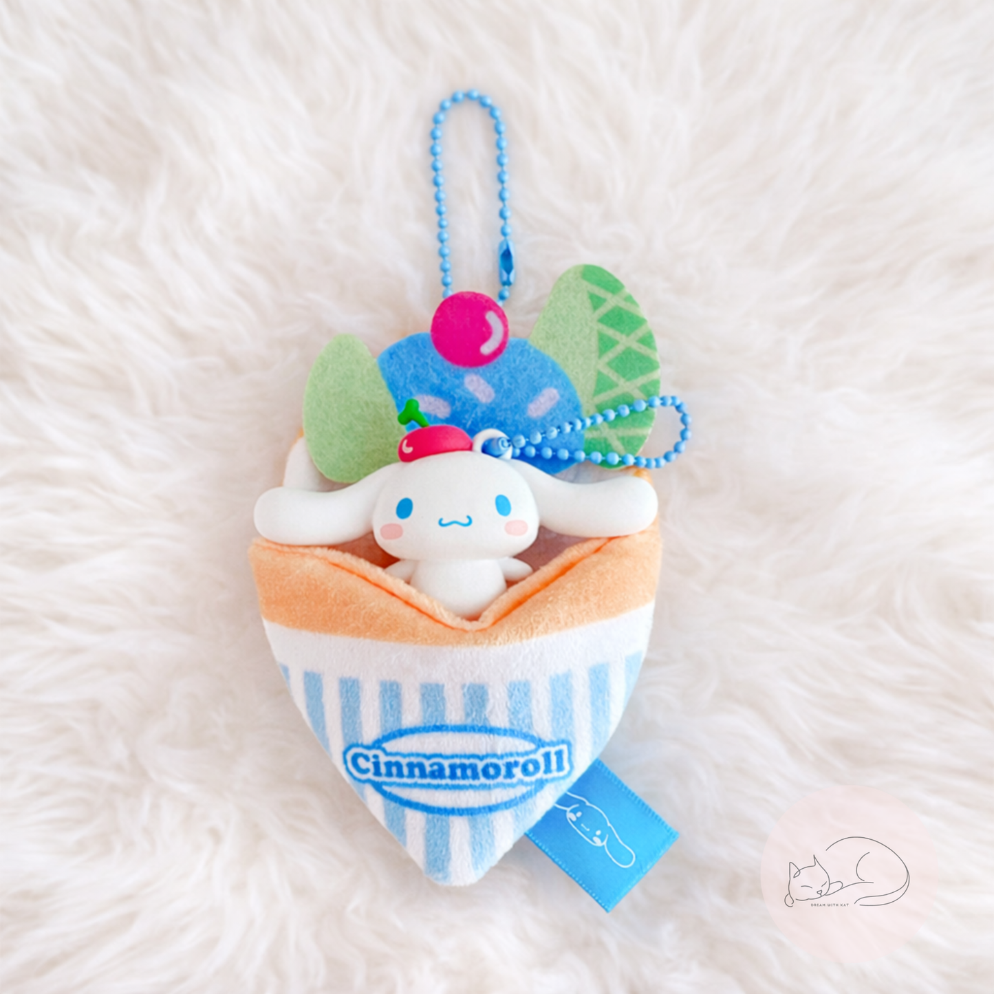 A soft and kawaii plush crepe keychain with cute details and a mini figure inside. Perfect as a bag charm, keychain or small collectible.
