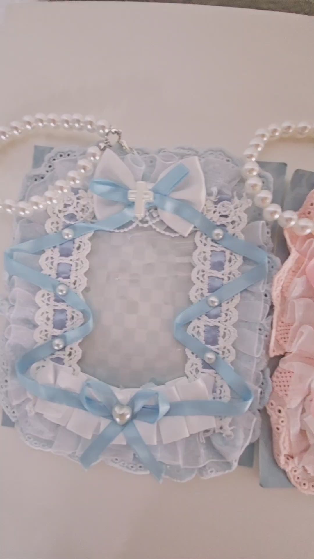 Lolita lace kawaii photocard holder in pastel pink, blue, and white with ruffles, bows, and a special cat ear design. Soft aesthetic card holder, 12.5x16 cm, fits K-pop photocards up to 6.7x9.5 cm. Cute accessory for bags, Sanrio fans, and kawaii collectors.