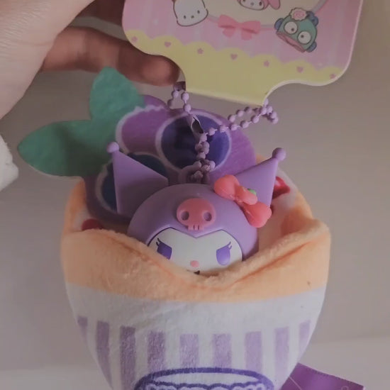 A soft and kawaii plush crepe keychain with cute details and a mini figure inside. Perfect as a bag charm, keychain or small collectible.