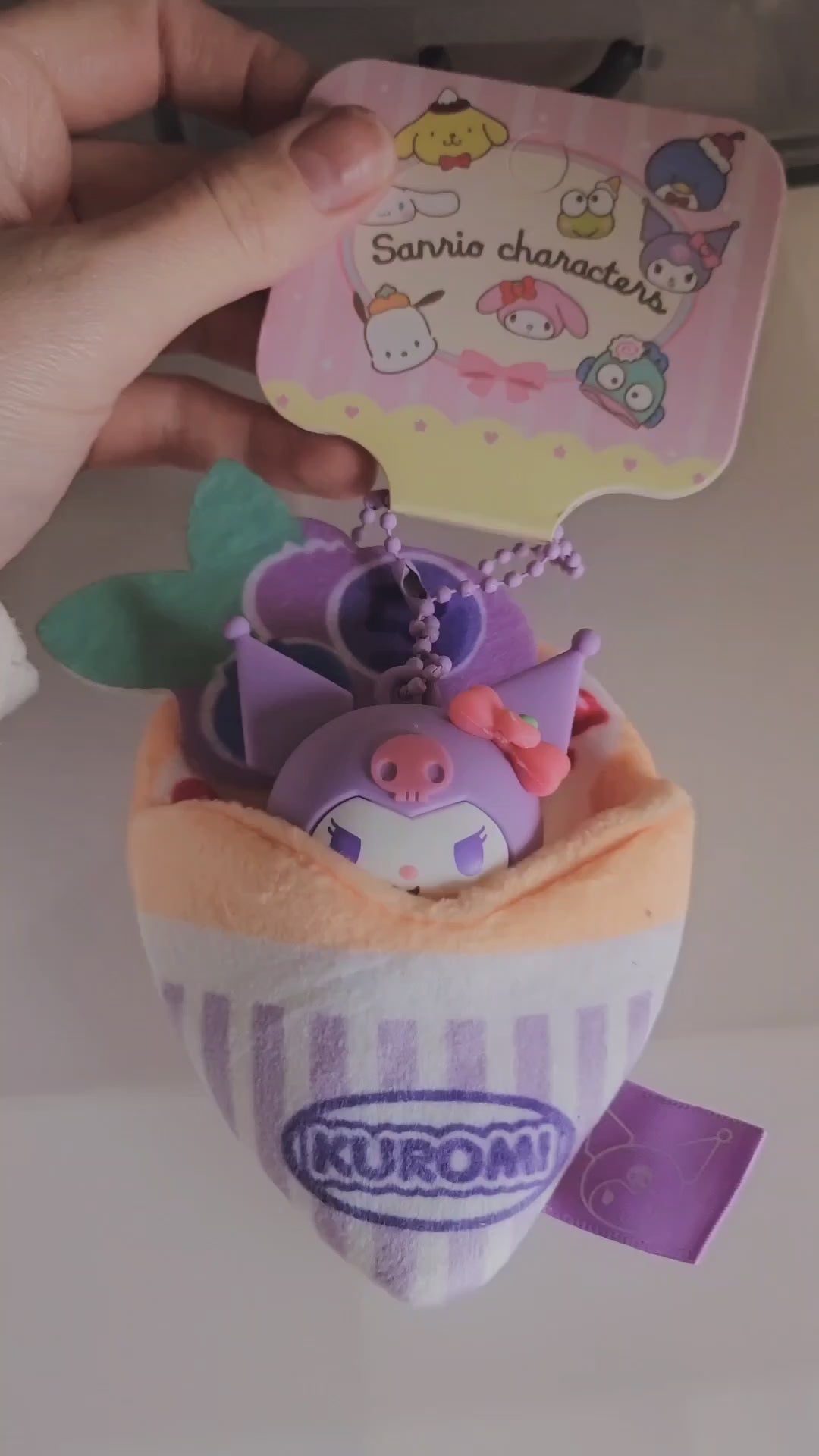 A soft and kawaii plush crepe keychain with cute details and a mini figure inside. Perfect as a bag charm, keychain or small collectible.